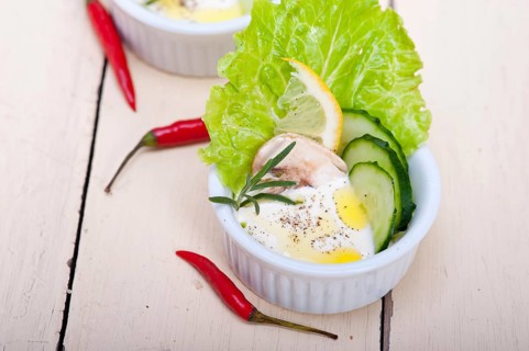 Fresh organic garlic cheese dip salad on a rustic table