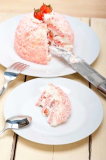 Fresh pink strawberry and whipped cream dessert macro close up