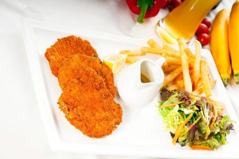 Classic breaded Milanese veal cutlets with french fries