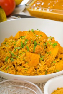 Fresh home made curry beef rice and potatoes with ingredients around composition