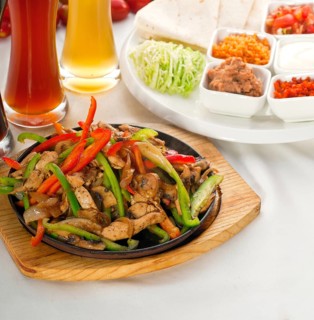 Original fajita sizzling smoking hot served on iron plate