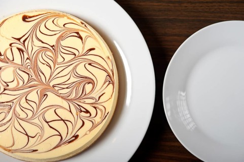 Fresh baked classic Cheese cake with chocolate topping