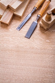 Chisel Woodworker Plane and wooden planks on board Construction concept