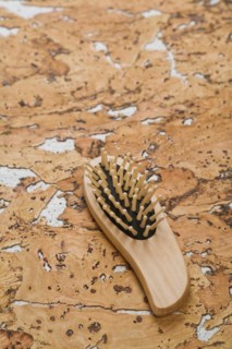 Hairbrush on cork wood
