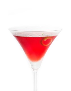 Cosmopolitan drink cocktail straight up on martini cup with lime peel isolated on white background