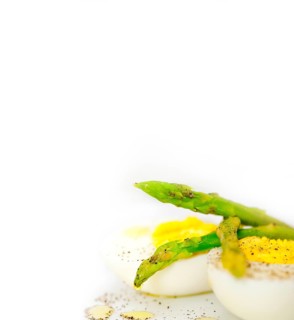 Boiled fresh green asparagus and eggs with extra virgin olive oil