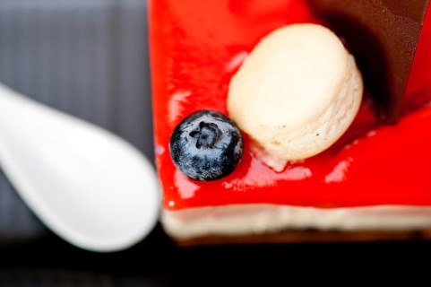 Fresh strawberry yogurt mousse with macaroon and blueberry on top