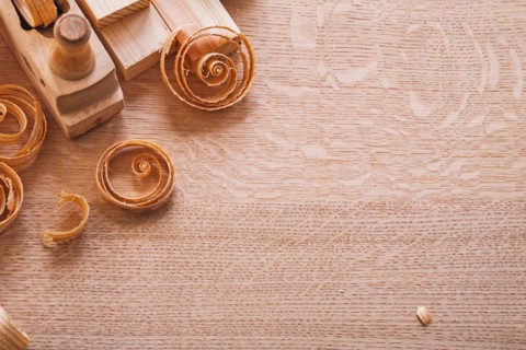 Copyspace image composition vintage woodworkers plane wooden planks and shavings construction concept