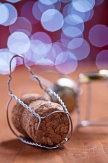 Champagne cork on wooden table close-up