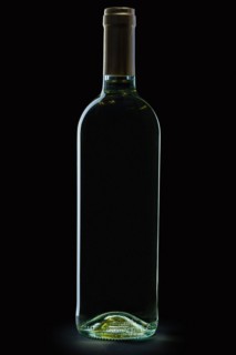 Bottle of white wine on black background