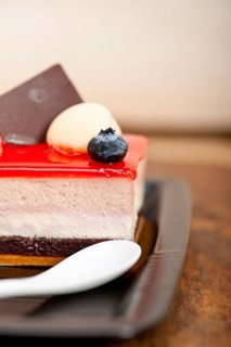 Fresh strawberry yogurt mousse with macaroon and blueberry on top