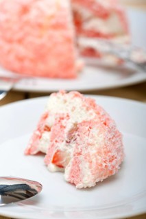 Fresh pink strawberry and whipped cream dessert macro close up