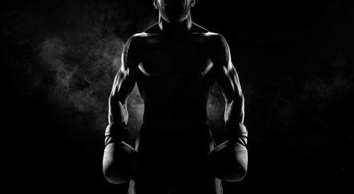 Noname image of a kickboxer on a dark background. The concept of mixed martial arts. MMA