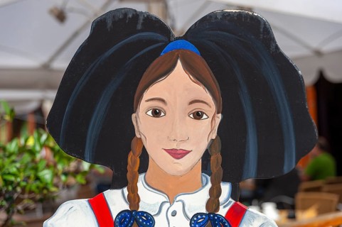 Wooden figure of a woman in traditional traditional costume
