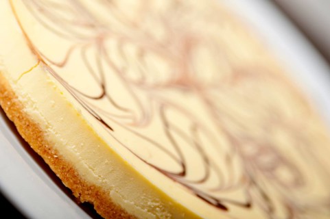 Fresh baked classic Cheese cake with chocolate topping