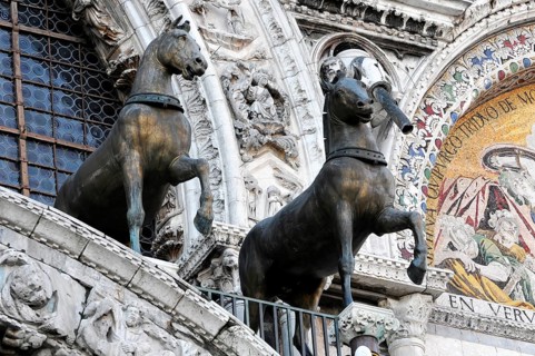 Quadriga of the horses of San Marco on St Mark's Basilica and the clock tower on St Mark's Square