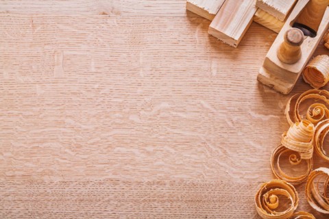 Copyapce image wood shavings old fashioned woodworker planing planks on board horizontal version building concept