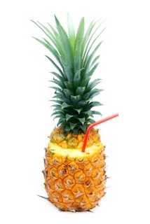Ripe vivid pineapple with red straw isolated over white background