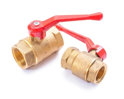 Brass sanitary fittings against a white background