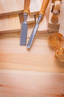 Copyspace image composition of woodworking tools carpentry chisel and plane on wooden boards building concept