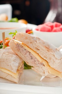 Tuna fish and cheese sandwich with fresh mixed salad