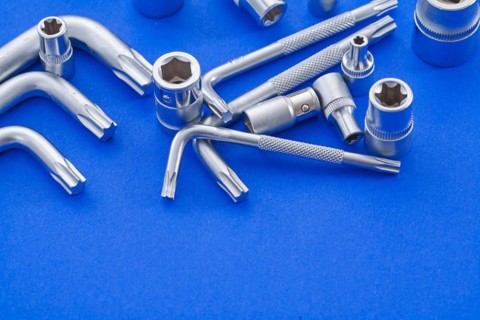 Hexagon spanner and Torx on blue background