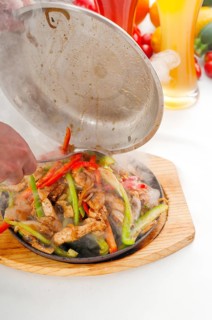 Original fajita sizzling smoking hot served on iron plate