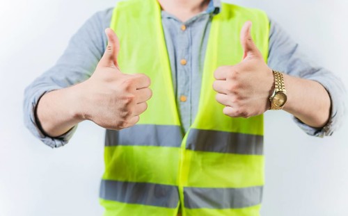 Engineer hands with thumbs up in approval gesture isolated. Engineer thumbs up in approval gesture on isolated background
