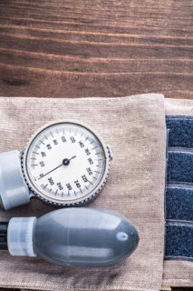 Medical devices Blood pressure monitor on wooden board