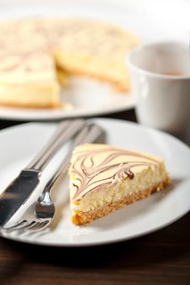 Fresh baked classic Cheese cake with chocolate topping and espresso coffee