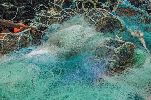 Turquoise fishing net and lobster baskets