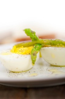 Boiled fresh green asparagus and eggs with extra virgin olive oil