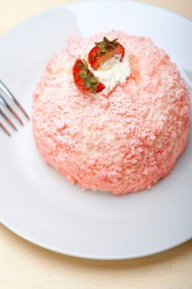 Fresh pink strawberry and whipped cream dessert macro close up