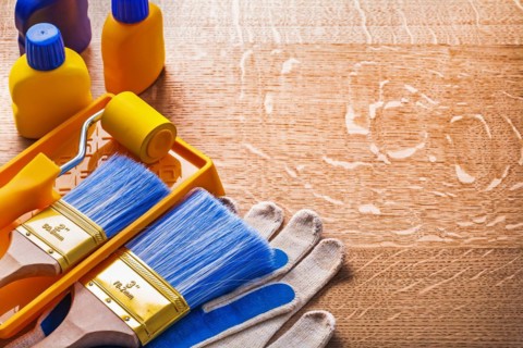 Home improvement paint tools on wooden board construction concept