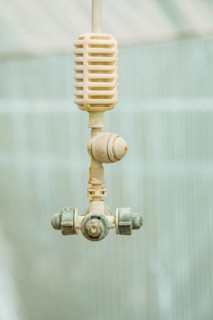 Agricultural equipment Water sprayer in the greenhouse Close-up