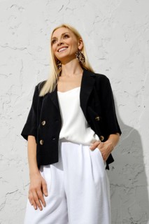 Low angle view portrait of fashionable smiling woman