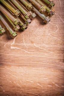 Dowel for concrete wall on wooden panel with organised copy space