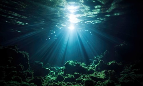 Underwater view of coral reef with sun rays shining through water surface Ai generated