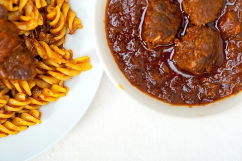 Fusilli pasta al dente with neapolitan style ragu meat sauce very different from bolognese style