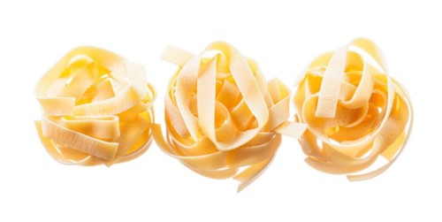 Raw twisted macaroni isolated on white