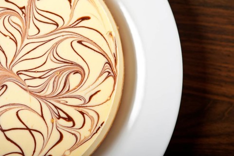 Fresh baked classic Cheese cake with chocolate topping