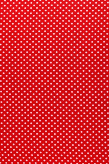 Red polka-dot cotton fabric vertical view