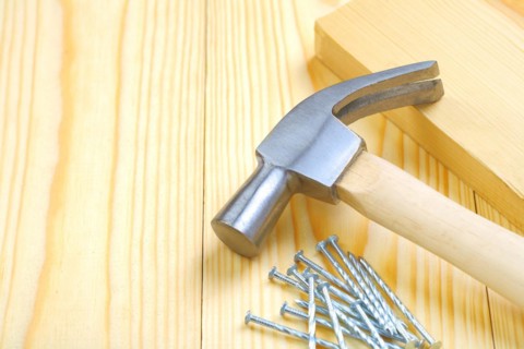 Hammer with nails and boards
