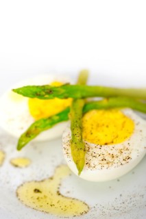 Boiled fresh green asparagus and eggs with extra virgin olive oil
