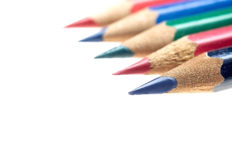Coulor wooden sharpened pencils over white background