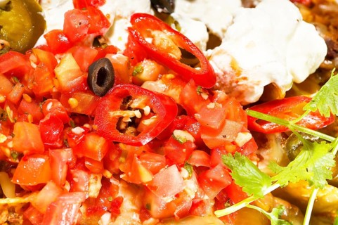 Fresh nachos and vegetable salad with meat