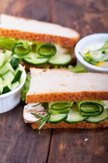 Fresh vegetarian sandwich with garlic cheese dip salad on rustic table