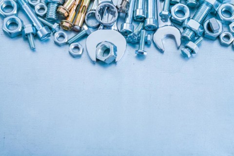 Anchor bolt Bolt nuts Hook spanner and flat spanner on metallic background Construction concept