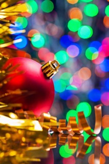 Christmas background red ball and tinsel on the background of the bokeh