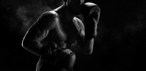 Noname image of a kickboxer on a dark background. The concept of mixed martial arts. MMA